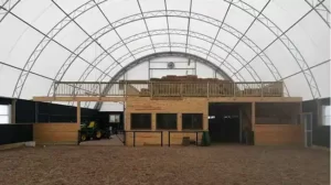 Hoop Barn riding arena with stable
