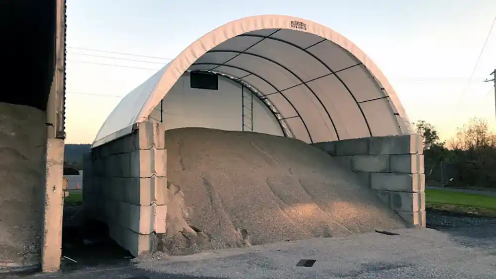 small hoop building on concrete eco block used for salt/sand shed