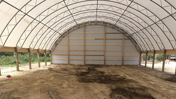 50' wide hoop barn with steel end and framing
